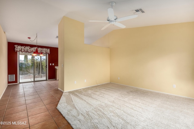 unfurnished room featuring light tile patterned floors, visible vents, a ceiling fan, light carpet, and vaulted ceiling