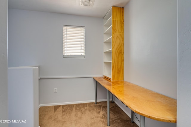 carpeted home office with baseboards and visible vents