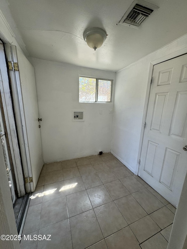 laundry area featuring hookup for a washing machine, laundry area, visible vents, and light tile patterned floors