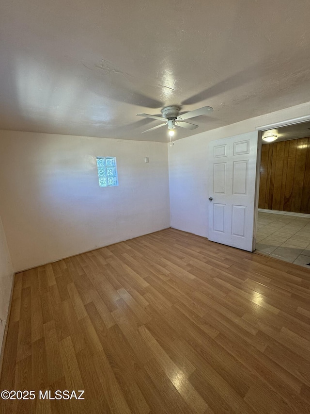 unfurnished room featuring ceiling fan and wood finished floors