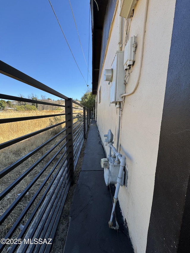 view of property exterior featuring fence and stucco siding