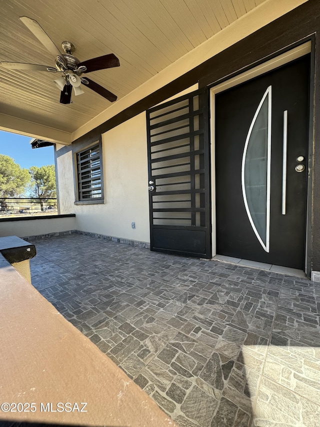 view of patio with ceiling fan