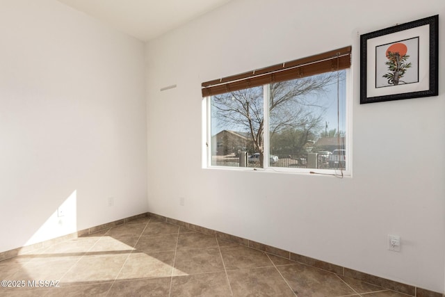 tiled spare room with baseboards