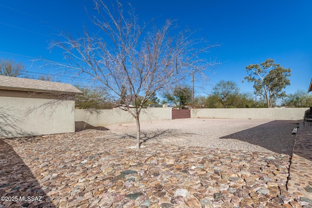 view of yard with a fenced backyard