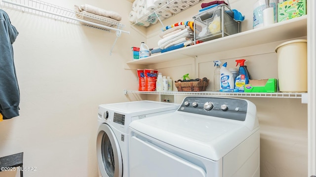 washroom featuring laundry area and washing machine and clothes dryer