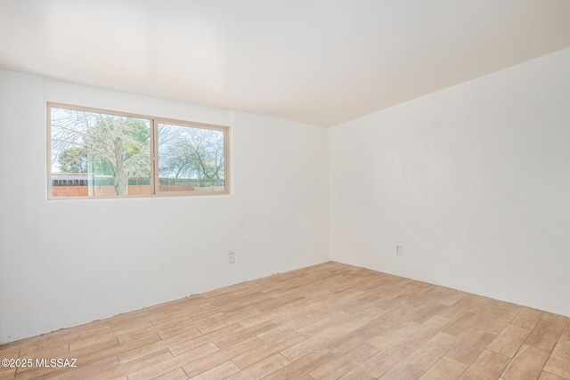 unfurnished room featuring light wood-style floors