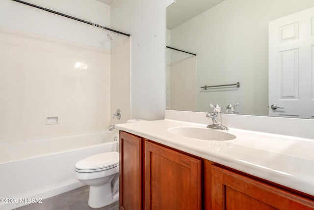 bathroom featuring shower / washtub combination, vanity, and toilet