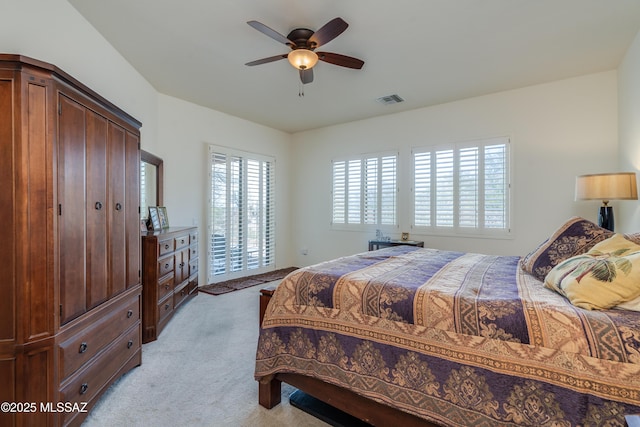 bedroom with light carpet, visible vents, ceiling fan, and access to exterior