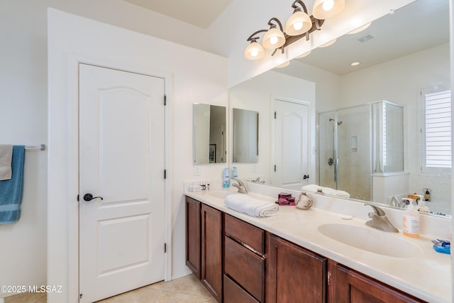 full bath featuring visible vents, a sink, a stall shower, and tile patterned floors