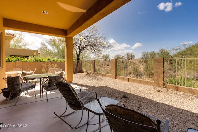 view of patio featuring a fenced backyard and outdoor dining space