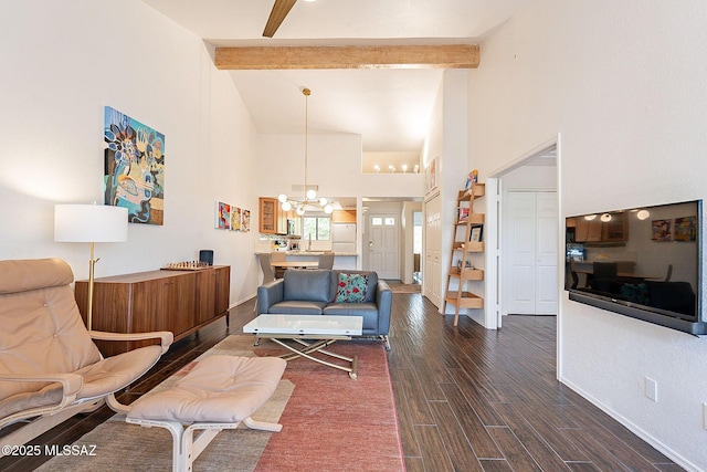 living area with baseboards, dark wood finished floors, beamed ceiling, high vaulted ceiling, and a notable chandelier