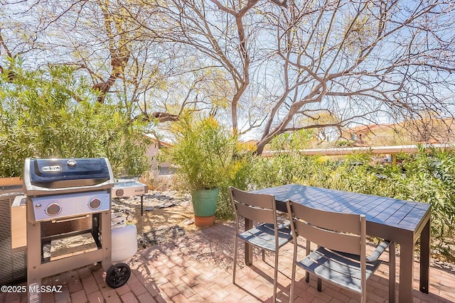 view of patio / terrace with outdoor dining area and a grill