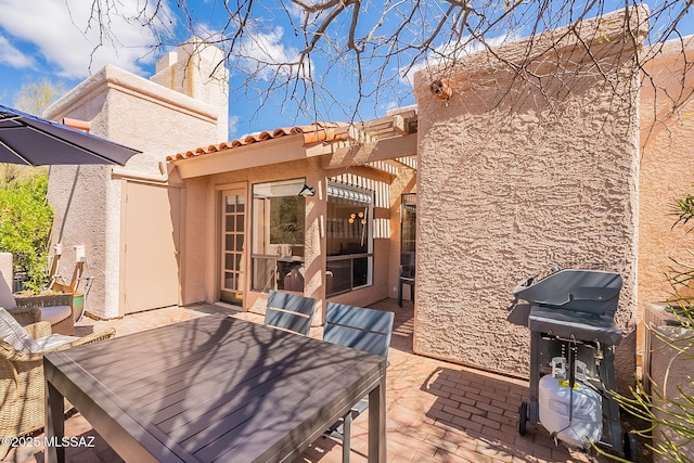 view of patio / terrace featuring outdoor dining space and area for grilling