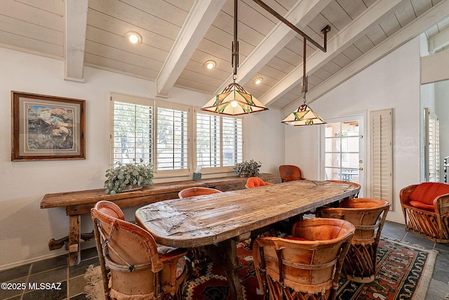 dining room featuring wood ceiling, a healthy amount of sunlight, vaulted ceiling with beams, and dark tile patterned floors