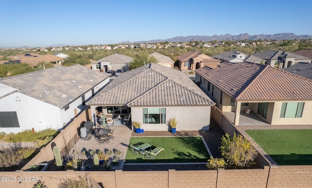 birds eye view of property featuring a mountain view and a residential view