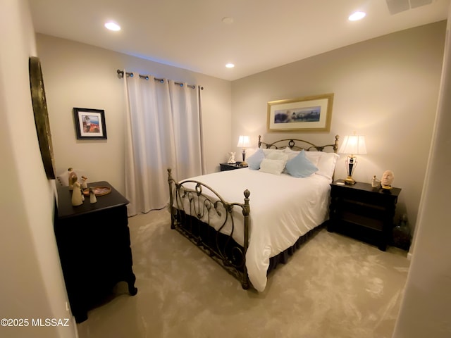 bedroom with light carpet and recessed lighting