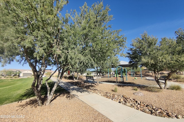 community jungle gym with a yard