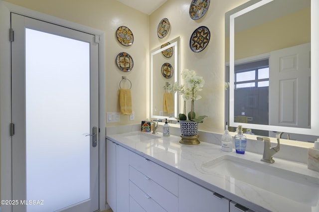 full bath with double vanity and a sink