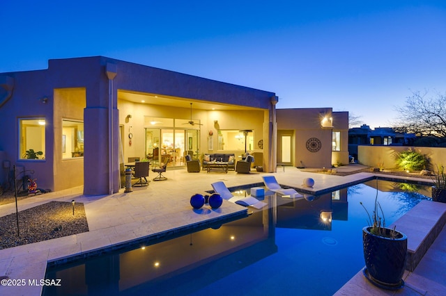 view of swimming pool with an outdoor hangout area, a patio, a fenced in pool, and a ceiling fan