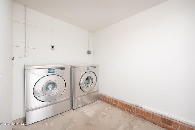 laundry room featuring washer and dryer and laundry area