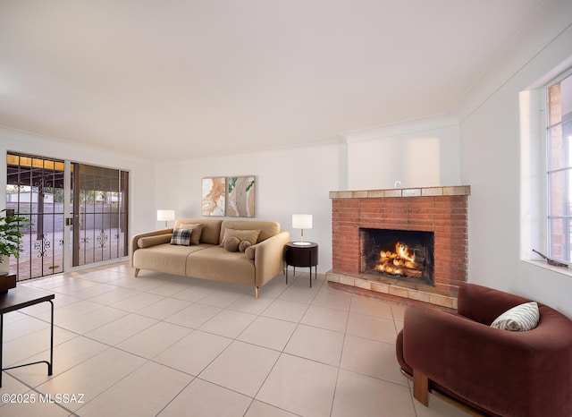 living area with light tile patterned floors, a fireplace, and ornamental molding