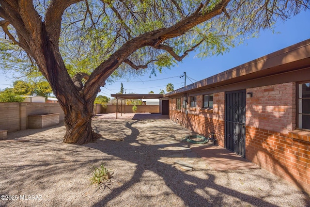 view of yard with a patio area and a fenced backyard