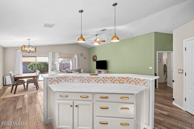 kitchen with light wood finished floors, visible vents, a sink, and appliances with stainless steel finishes