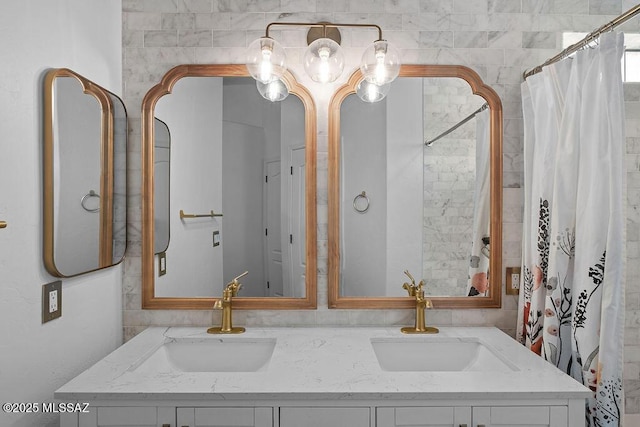 full bath featuring shower / tub combo, a sink, and double vanity