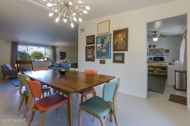 dining room with visible vents, finished concrete flooring, baseboards, and an inviting chandelier