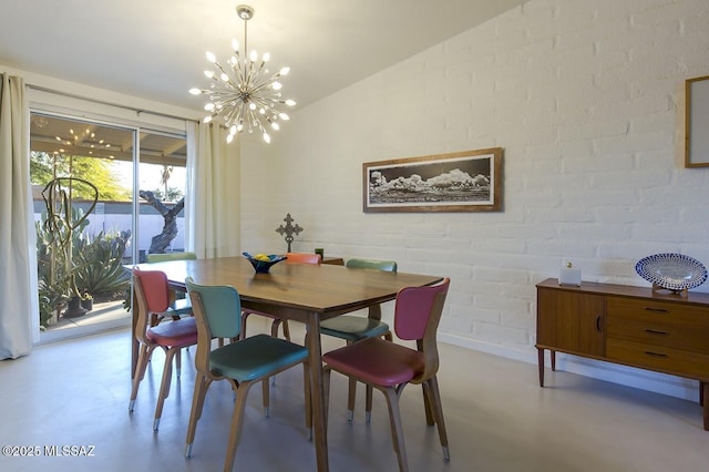 dining area with lofted ceiling, concrete floors, baseboards, and a notable chandelier