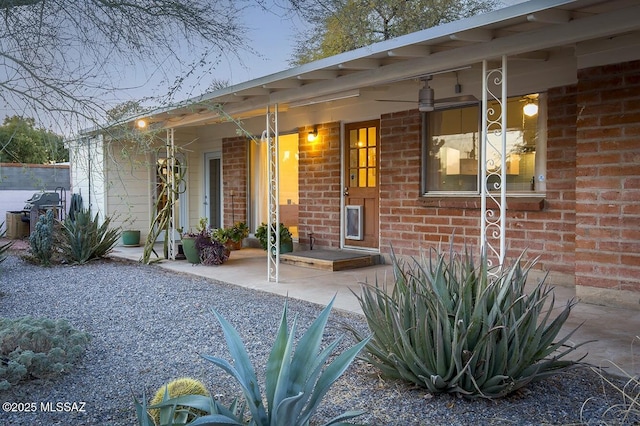 entrance to property with brick siding