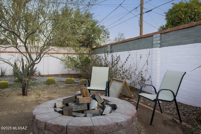 view of patio / terrace with a fire pit