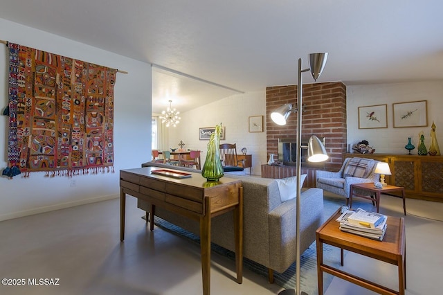 living room featuring lofted ceiling, a brick fireplace, finished concrete flooring, and baseboards