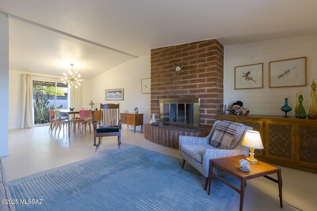 living room with lofted ceiling, a fireplace, and a notable chandelier