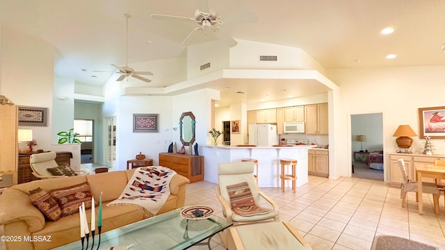 living area featuring ceiling fan, high vaulted ceiling, light tile patterned flooring, recessed lighting, and visible vents