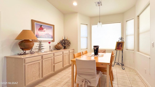 dining space with light tile patterned floors, recessed lighting, visible vents, and baseboards