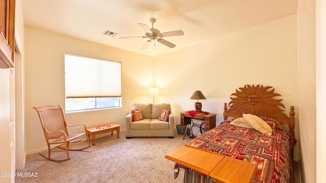 carpeted bedroom featuring visible vents and a ceiling fan