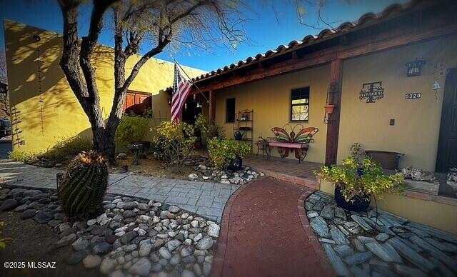 exterior space featuring a patio and stucco siding