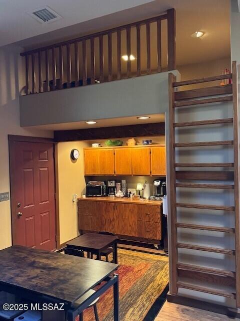 kitchen featuring light wood-type flooring and visible vents