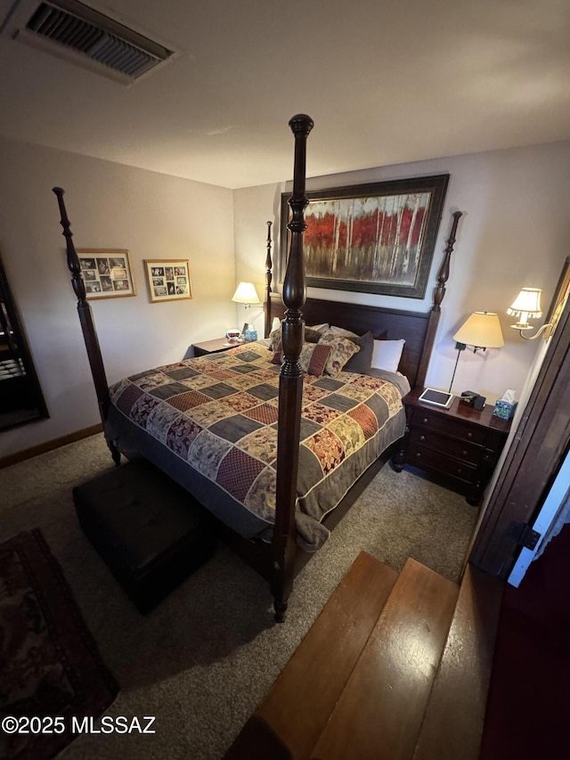 carpeted bedroom featuring visible vents and baseboards