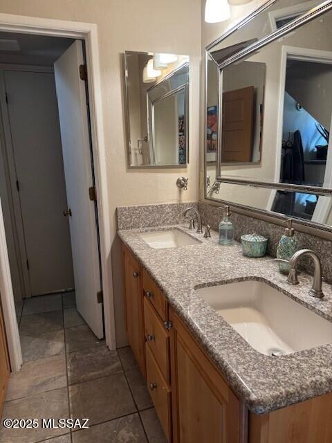 bathroom featuring double vanity and a sink