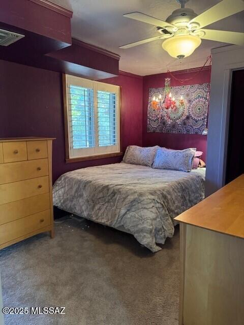 bedroom featuring ceiling fan, carpet, and visible vents