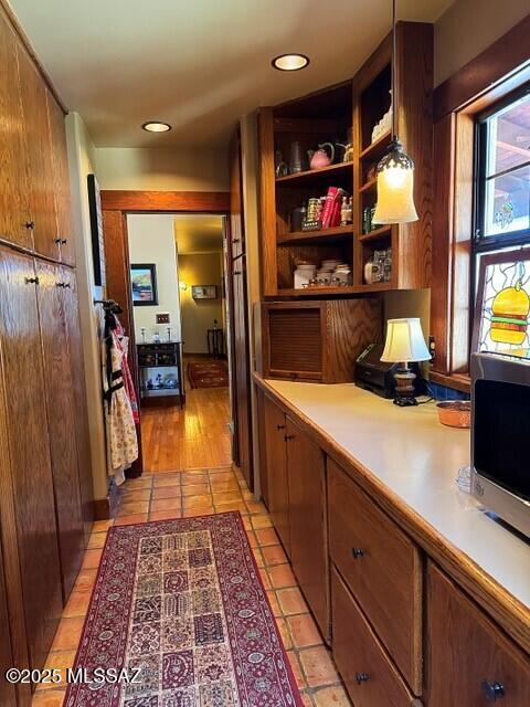 hall with light tile patterned floors and recessed lighting