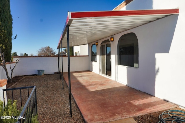 view of patio / terrace featuring fence