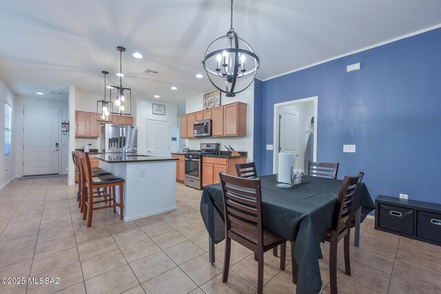 dining space featuring baseboards, recessed lighting, light tile patterned floors, and an inviting chandelier