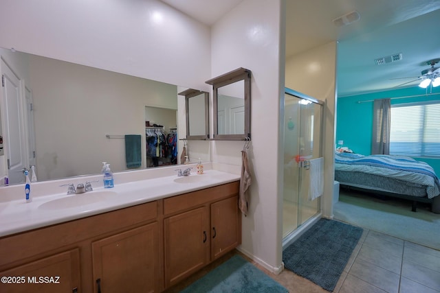 full bathroom featuring visible vents, a sink, and a ceiling fan