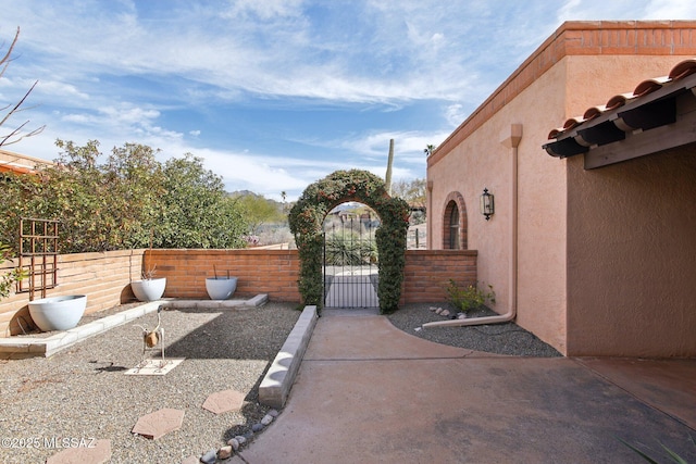 exterior space featuring a gate and fence