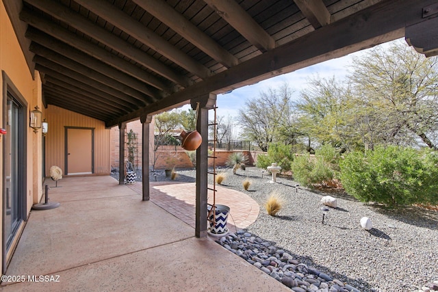 view of patio / terrace featuring fence