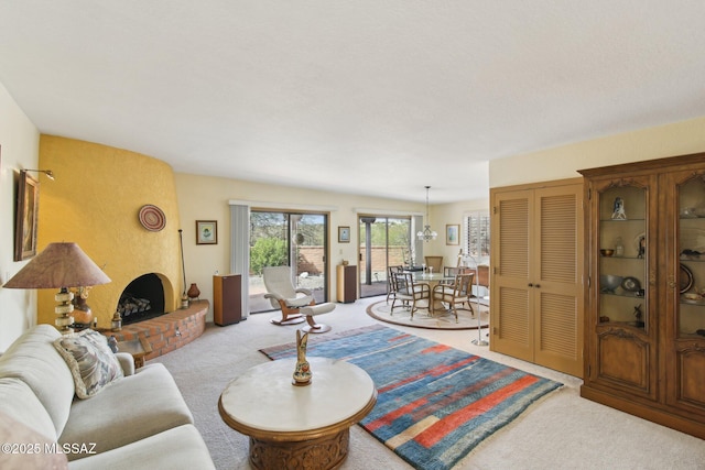 carpeted living room with a brick fireplace