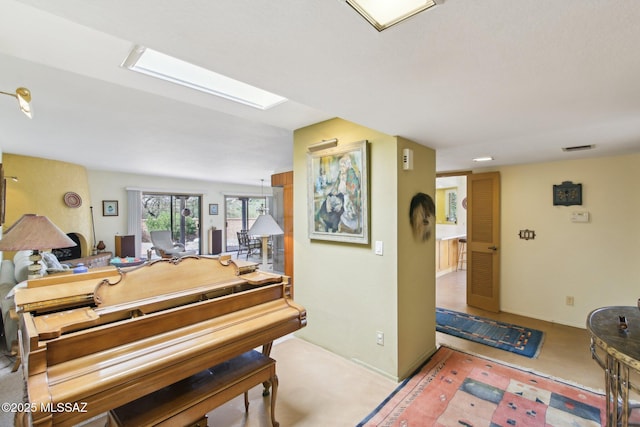 interior space featuring visible vents and a skylight